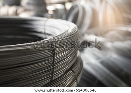 Stainless Steel wire Rolls in the construction site. Closeup of Metal Steel reinforced rod for concrete in store. Construction Concept.