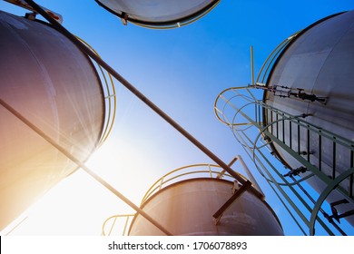 Stainless tanks and pipeline for liquid chemical industrial on blue sky background