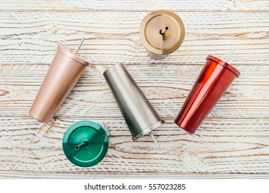 Stainless And Tumbler Cup On Wooden Background