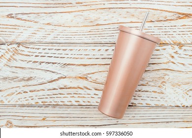 Stainless And Tumbler Cup On Wooden Background