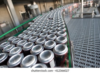 Stain-roof Jars With Drinks On The Assembly Line. For The Production Of Alcoholic And Soft Drinks Line. The Final Stage In The Manufacture Of The Product.