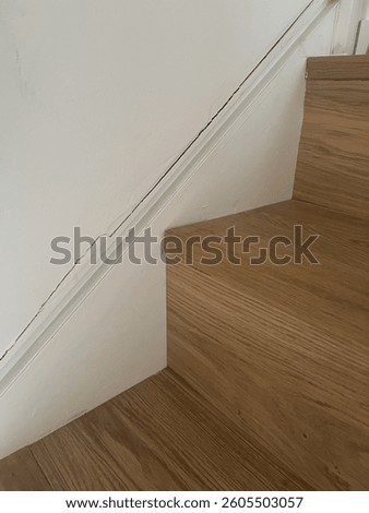 A stair case with cracking drywall