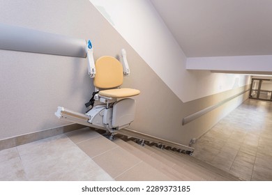A stair chair that allows people with mobility disabilities to climb stairs. - Shutterstock ID 2289373185