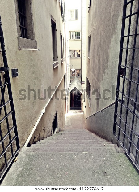 A stair at Old town of Zürich/Zurich. Everywhere a\
lot of stairs to go. Suisse is very expensive and a lot of People\
go around by bicycles. But it is still faster to go by bicycle,\
Train, bus or car.
