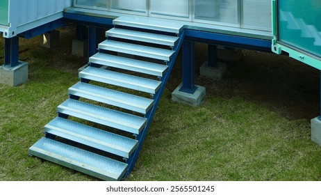 A staircase architecturally connecting upper and lower floors, creating a vertical link between spaces.