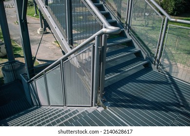 staircase architecture: particular external double flight staircase, for public pedestrian walkway, in fireproof galvanized steel.