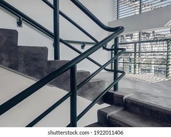 Staircase cement in the parking in shopping mall.retro tone.iron railing