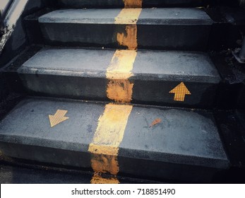 staircase with up and down arrow signs on the ground, for any work about construction, people's, life, business, and abstract concept background.
