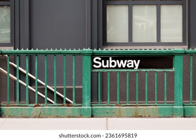 A staircase entrance to a subway station in downtown Manhattan, New York - Powered by Shutterstock