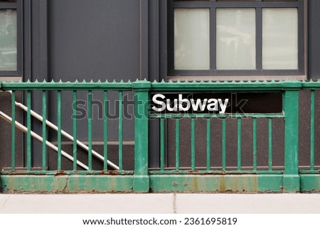 A staircase entrance to a subway station in downtown Manhattan, New York