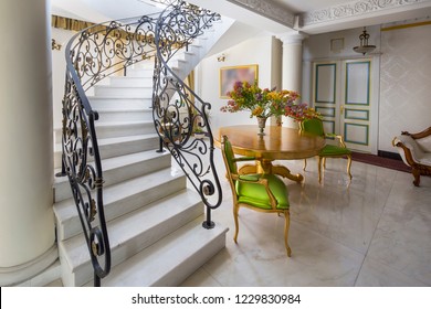 Staircase with handmade wrought Iron Railing. luxury lobby interior