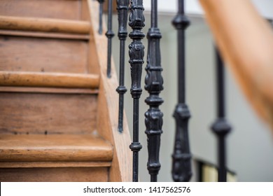 Staircase Handrailing In Old Historic Building. Interior Decor Of Vintage Stairs With Metal Ornament And White Wall Background. House Design Detail Of Historical Stair Case With No People 