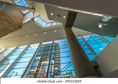 Staircase Painted In Red. Abstract Fragment Of Urban Architecture Of Modern Luxury Building, Center, Hotel, Shopping Mall, Business Centre.   Interior Design. Vertical.