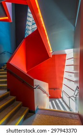 Staircase Painted In Red. Abstract Fragment Of Urban Architecture Of Modern Luxury Building, Center, Hotel, Shopping Mall, Business Centre.   Interior Design.