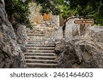 Staircase in Port De Sa Calobra, leading hikers to Torrent de Pareis canyon, epitomizing Mallorca allure as a premier travel destination, suitable for illustrating travel brochures and tourist guides.