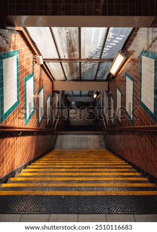 A staircase with steps going down on a subway station