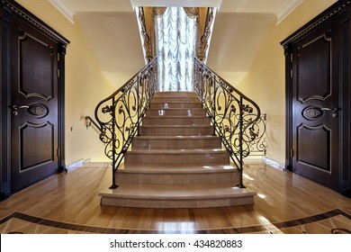 Staircase With Wrought Iron Railing