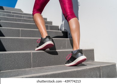 Stairs Climbing Running Woman Doing Run Up Steps On Staircase. Female Runner Athlete Going Up Stairs In Urban City Doing Cardio Sport Workout Run Outside During Summer. Activewear Leggings And Shoes.