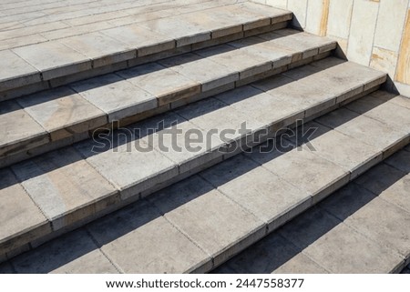 Stairs corner, in the sun with tree shadows, abstract texture backdrop
