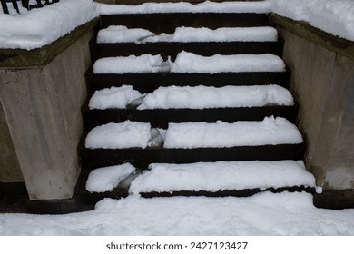 stairs covered in snow with stepping marks - Powered by Shutterstock