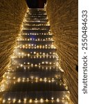 Stairs framed by Christmas garland