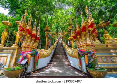 The stairs with a gold serpent statue at Wat Cha Am Khiri, Phetchaburi, Thailand - Shutterstock ID 2193869497