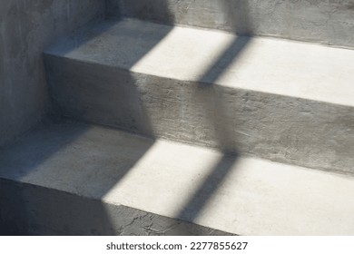 Stairs. Gray concrete staircase in the street at the entrance to the building. Light and shadow. Summer. Day. Grunge. Close-up. - Shutterstock ID 2277855627