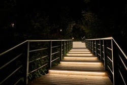     Stairs With Green Railings In A City Park With LED Lighting At Night                           