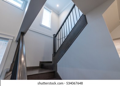 Stairs and handrail leading to the upper, low level. Interior design. - Powered by Shutterstock