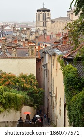 Stairs up the hill of Vieux Lyon to the Basilica Notre Dame de Fourviere and view over the roofs in Old Town of Lyon in France