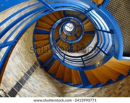The stairs inside a lighthouse wind upwards.
