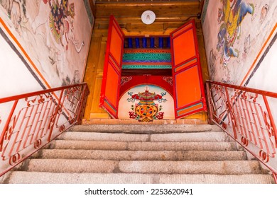 Stairs leading to a painted door of a Tibetan prayer hall at Kumbum Champa Ling Monastery near Xining, China - Shutterstock ID 2253620941
