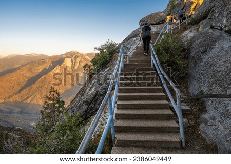 Stairs leading up to touristic viewpoint Moro Rock in Sequoia National Park during sunset. 