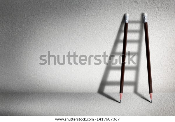 Stairs with pencil for effort\
and challenge in business to be achievement and successful\
concept.\
