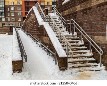 The Stairs And Ramp Near The Apartment Building Are Covered With Snow. High Quality Photo