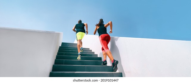 Stairs runners running up training hiit workout banner. Couple athletes sprinting uphill working out dynamic exercise panoramic. - Shutterstock ID 2019101447
