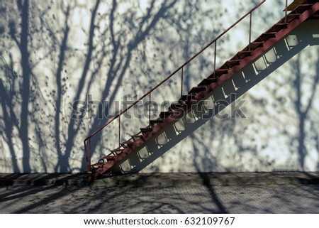 Stairs up the wall with shadow