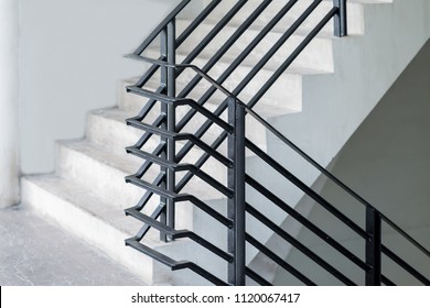 Stairway with black metallic banister in a new modern building architecture - Powered by Shutterstock