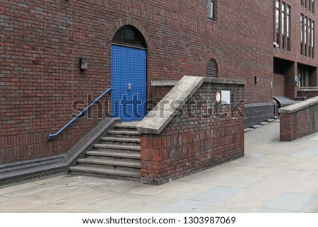 Similar – Blue railing on brick wall