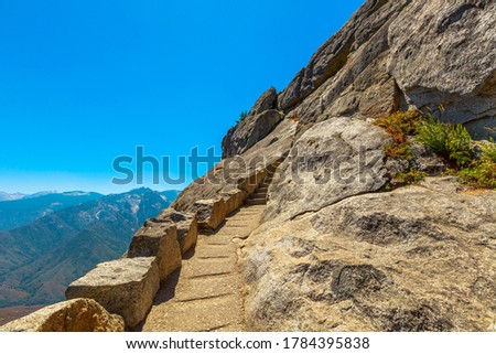 Stairway steps of the top of Moro Rock trail in summer in California, United States of America in Sequoia National Park.