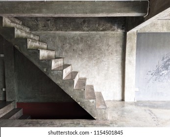 Stairway, Style, Bare Cement In The Building, The Wall Is Bare. Have A Way Down To The Lower Floor, Dark Below, Taken From The Side.