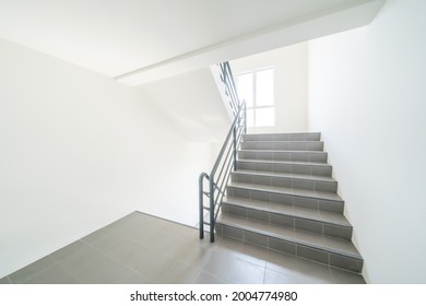 Stairwell to emergency exit or stairwell fire escape in building.
