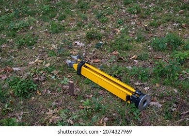 Stake Driven Into The Ground As A Topographic Base And Tripod For The Total Station. Survey Work Concept.