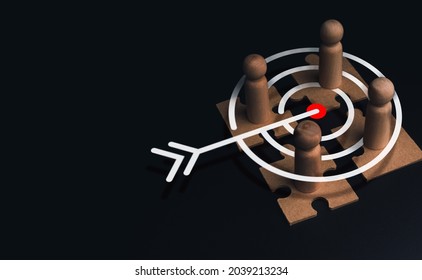 Stakeholder, business connection, teamwork, and team building concept. Close-up wooden figure, as businessman on jigsaw puzzles with target icon symbol on dark background with copy space.