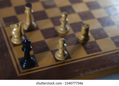 Stalemate situation as the black king is stuck with no moves by many white pieces in a chess game. - Shutterstock ID 1540777346