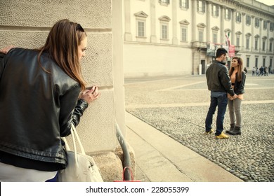 Stalking - Ex girlfriend spying her ex boyfriend with another woman - stalking,infidelity and jealousy concepts