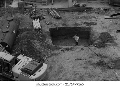 Stamford, Connecticut USA - Circa September 2021: Lone Construction Worker Performing Manual Labor At True North Construction Site.