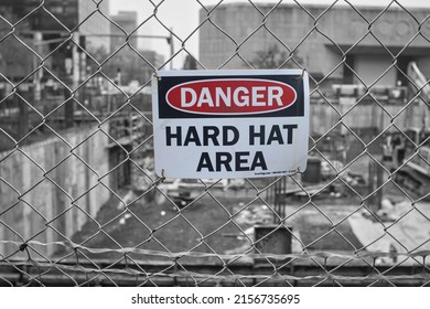 Stamford, Connecticut USA - May 15, 2022: Danger sign on fence at Stamford construction site. Downtown buildings in greyscale background. - Shutterstock ID 2156735695