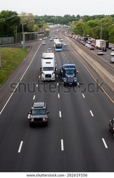 Stamford, CT - May 29,\
2015: Daytime traffic on the interstate highway on May 29, 2015 in\
Stamford\
Connecticut\
