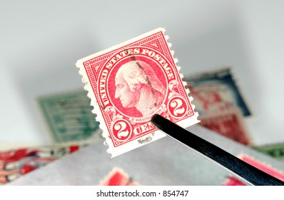 Stamp Being Held By Tweezers - Stamp Collecting Concept